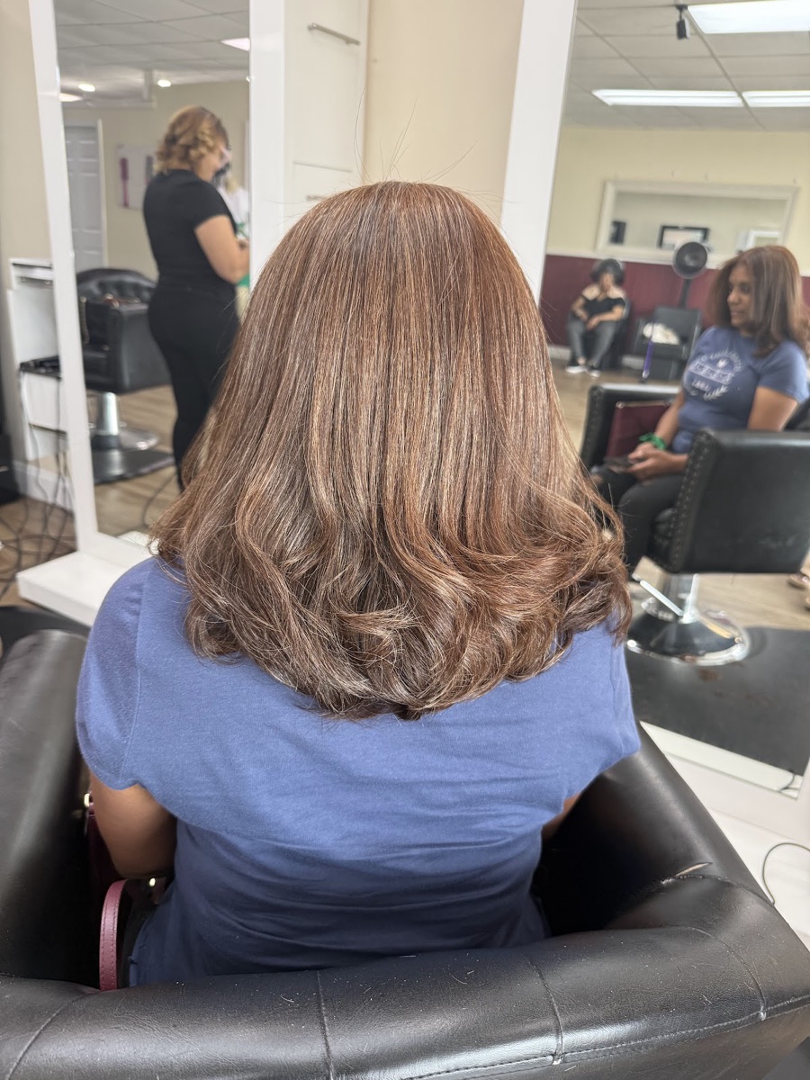 A soft, voluminous blowout in progress inside Rosy Dominican Hair Spa