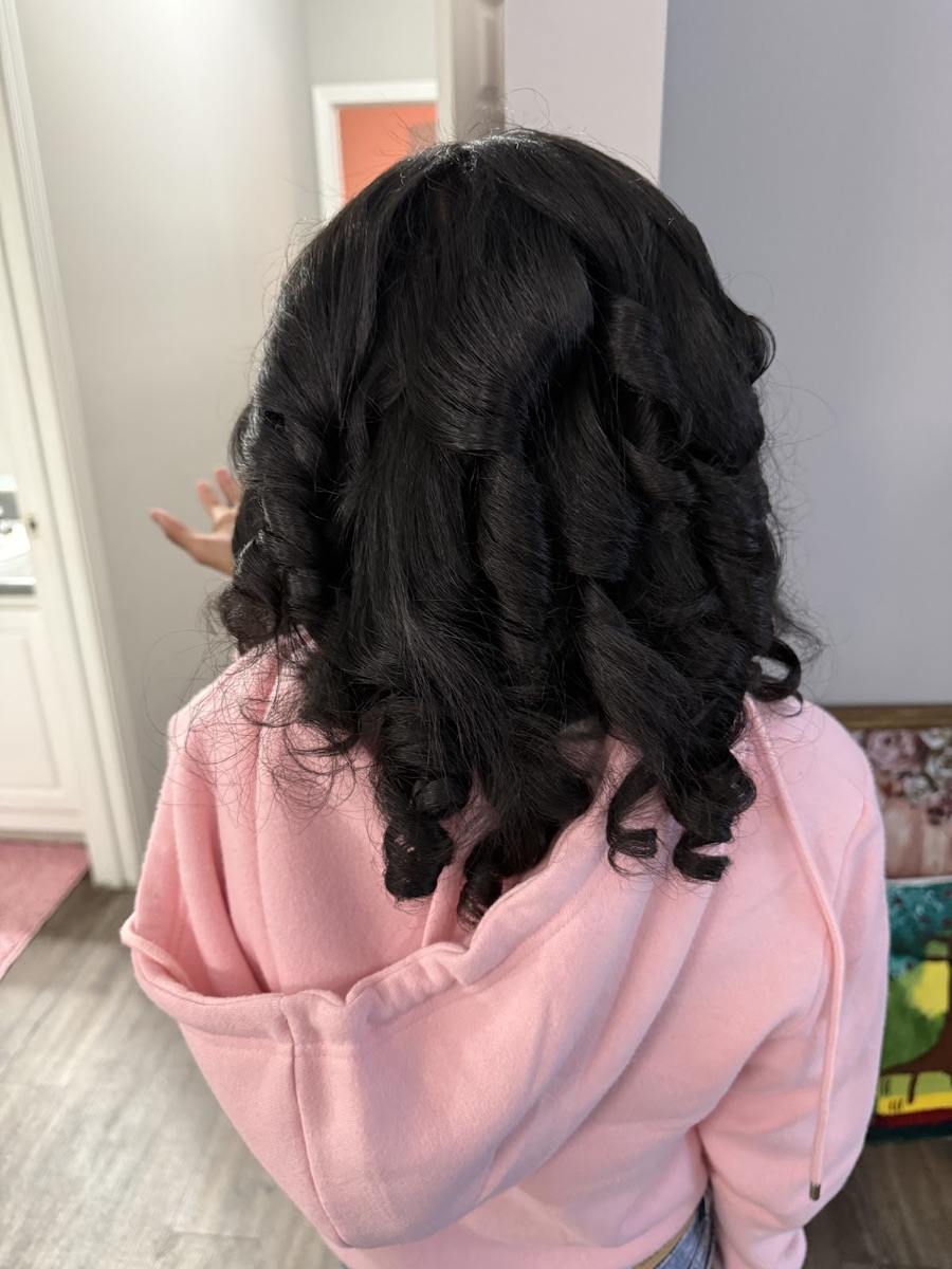 Tight, defined ringlet curls on dark hair after a wash and style
