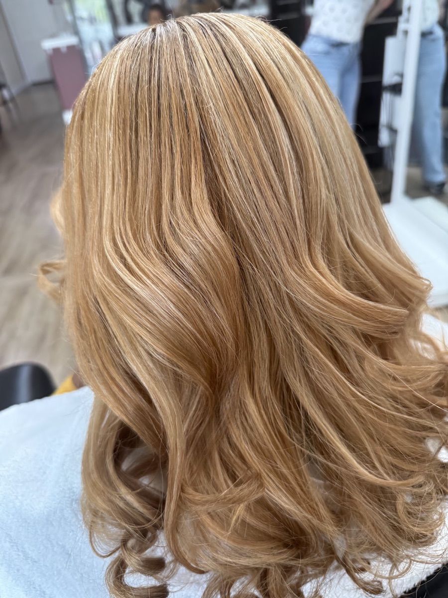 Honey-blonde blowout with soft, full waves